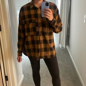 Women’s orange and black plaid shirt